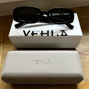Vehla Olsen sunglasses. Rectangular frame, Black acetate with a smoke grey lens